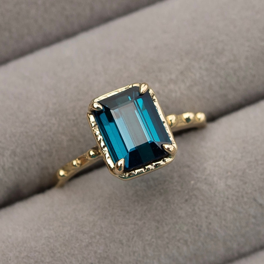 emerald cut blue tourmaline ring